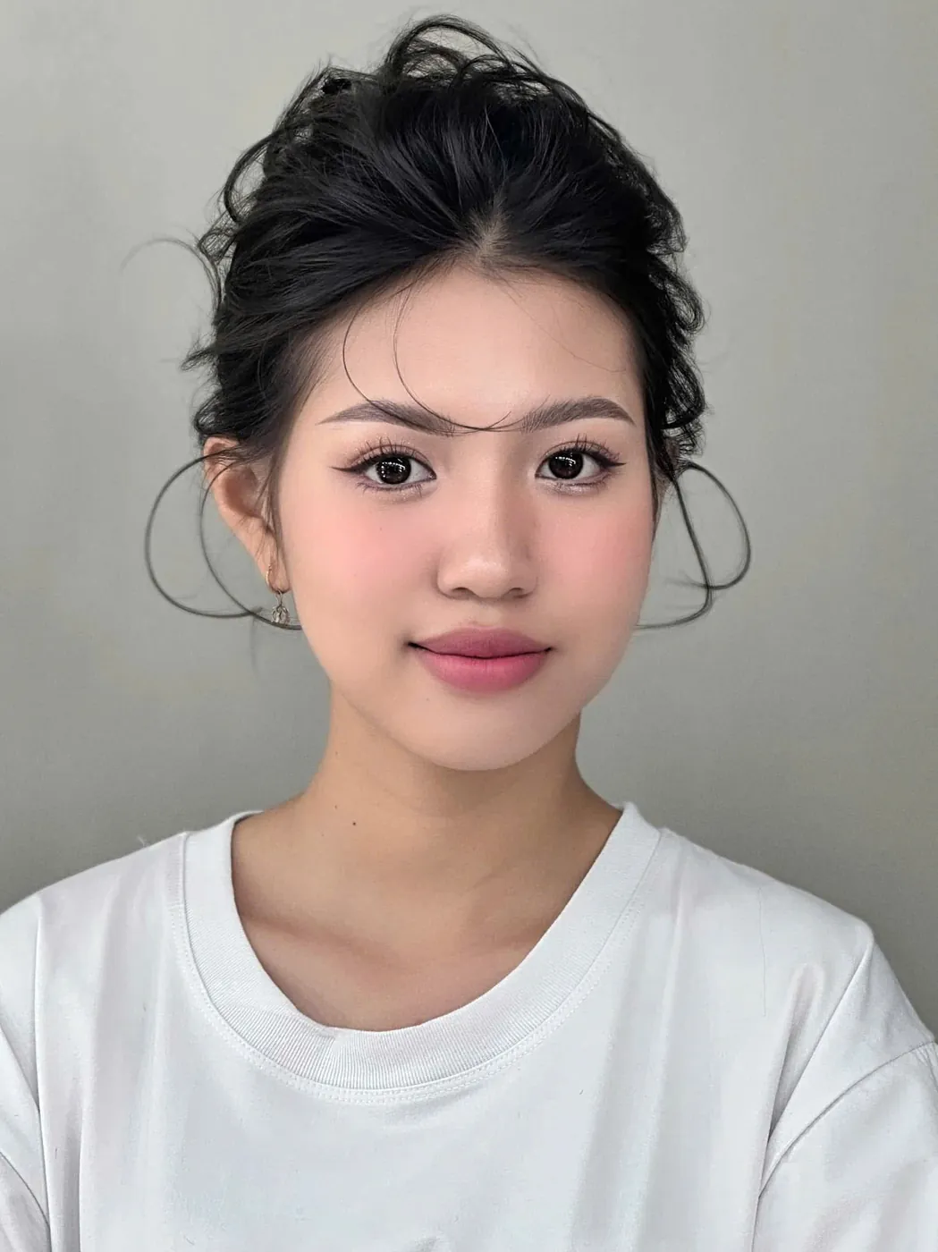 Soft bridal makeup with a loose updo